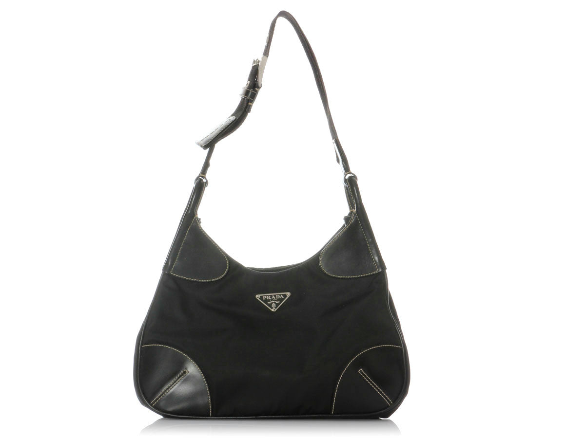 black prada bag with white stitching