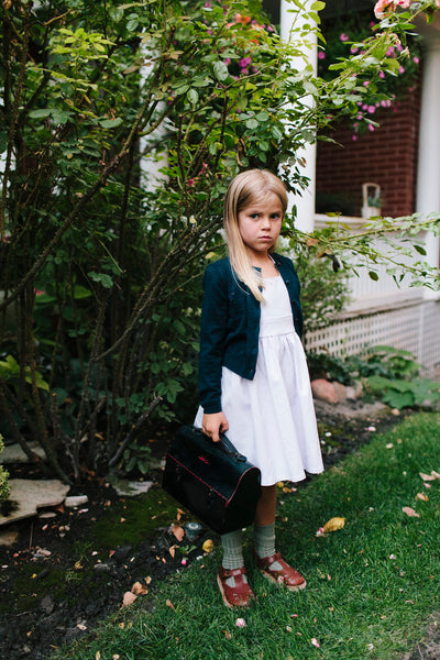 Wren & James linen pinafore in Orchid pairs well with a Jade cardigan for fall or winter.