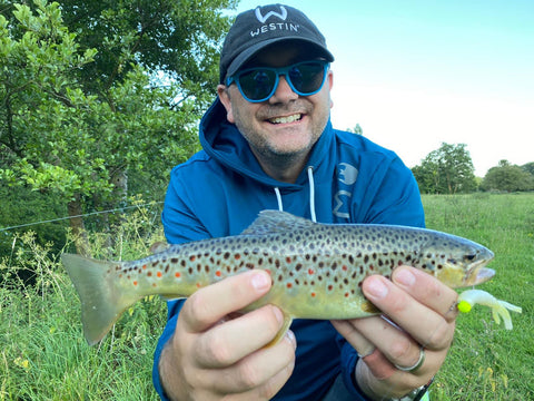 fisherman showing fish