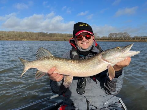 fisherman showing fish