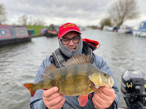 fisherman showing fish