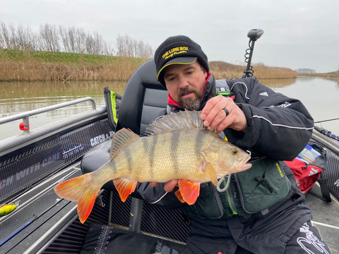 fisherman showing fish