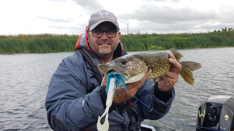 fisherman showing fish