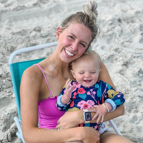 Mom and baby on the beach. 