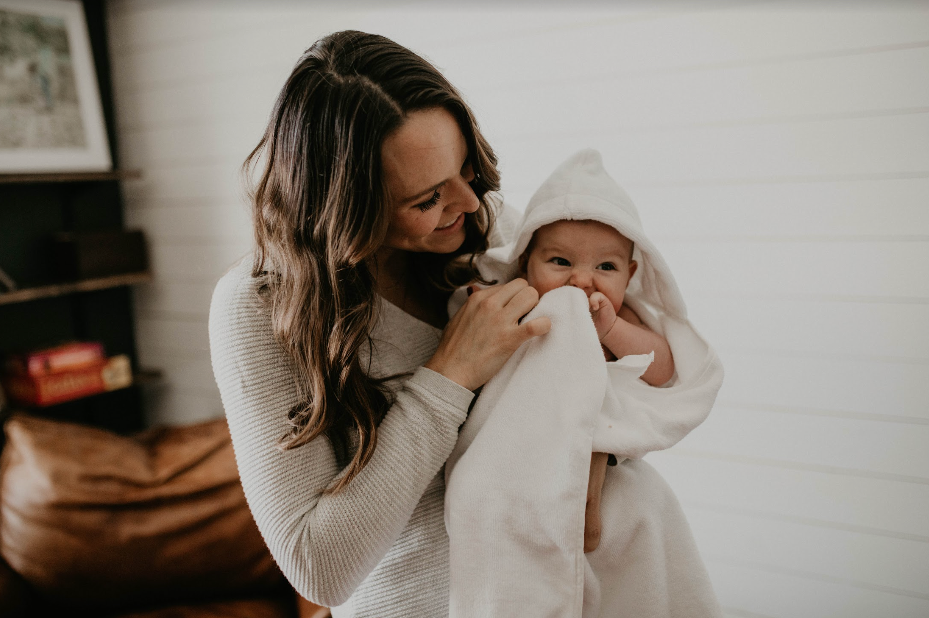 Mom Holding Baby Swaddled in Baby Towel