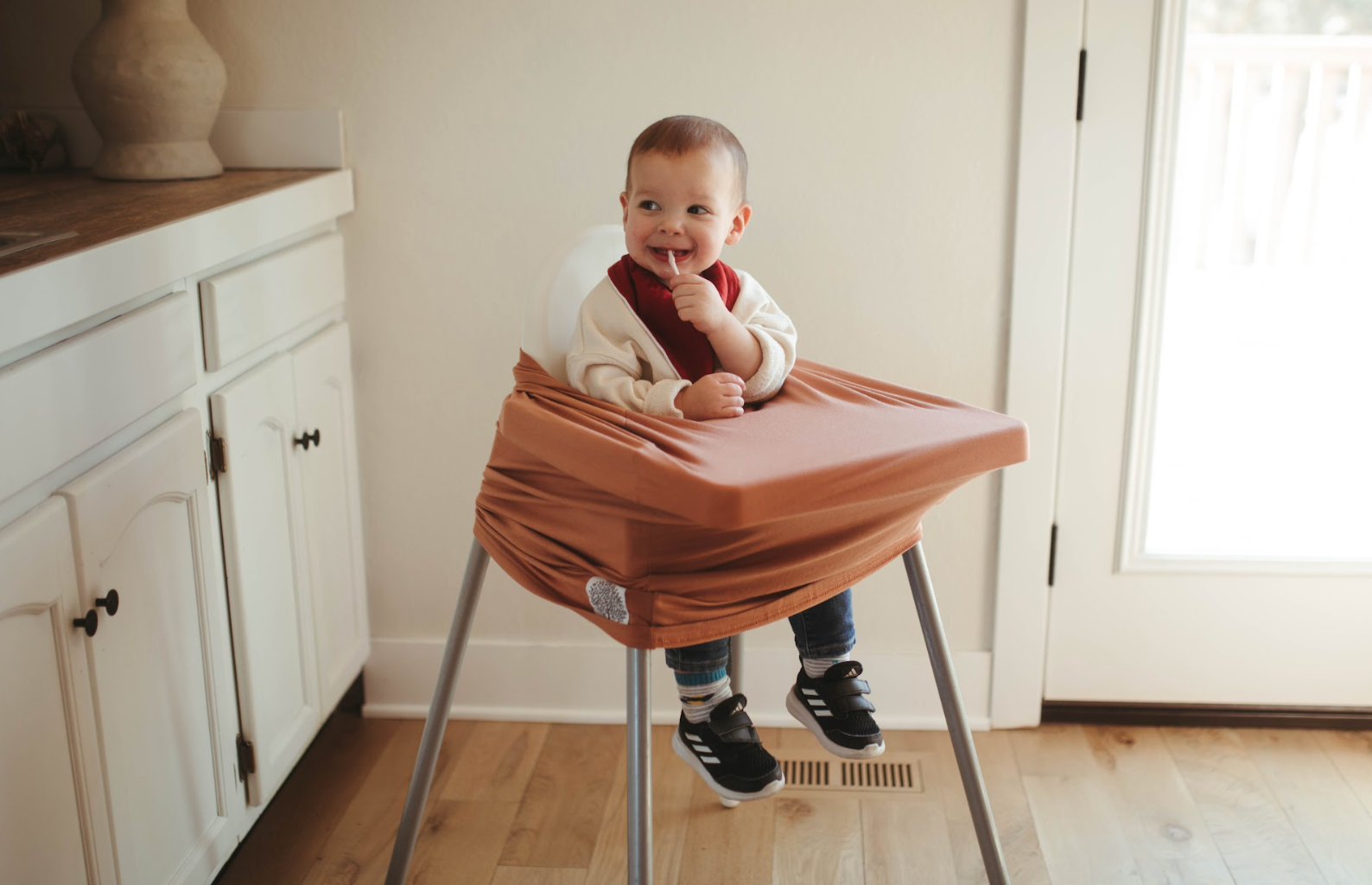Baby Sitting in High Chair with High Chair Cover