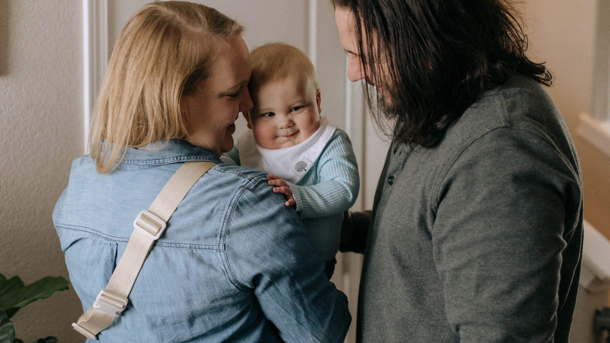 Mom Holding Baby Wearing Bandana Bib