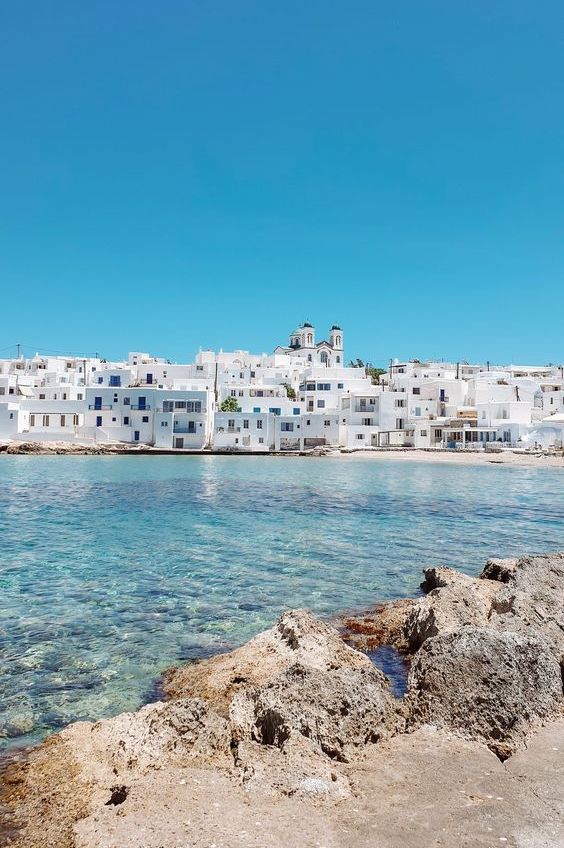 Iconic white-building scenery at Paros, along the peaceful, turquoise sea water