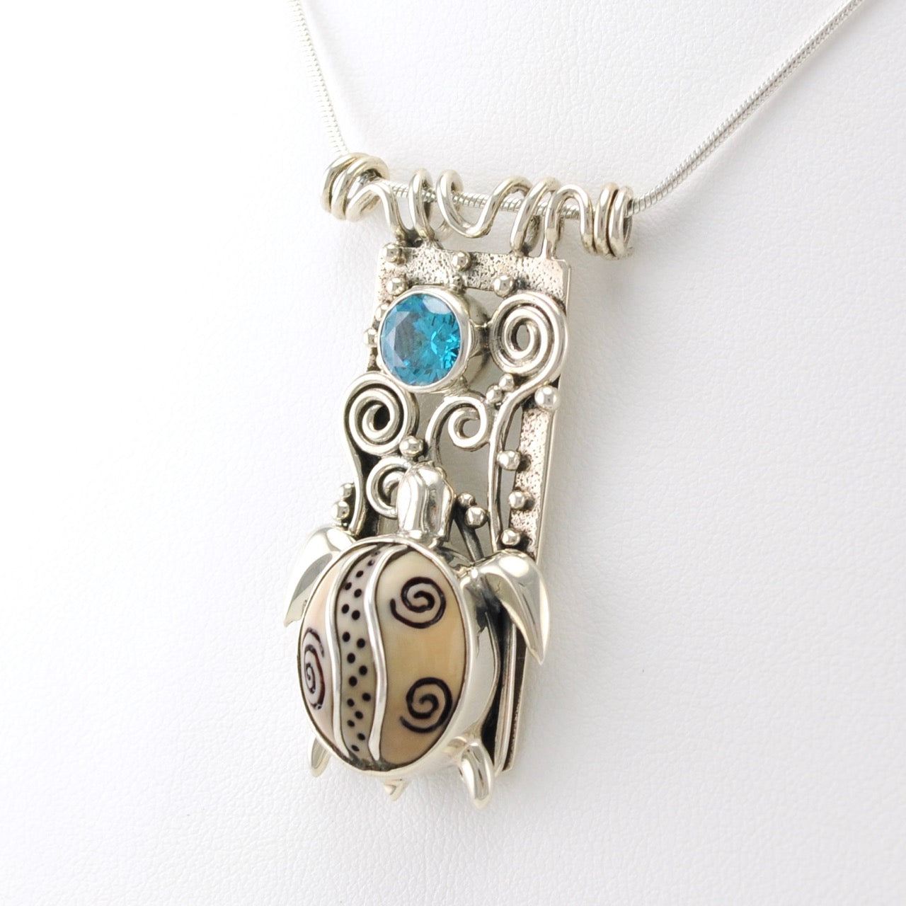 Fossilized Walrus Ivory Tusk Silver Fish Necklace with Blue Topaz