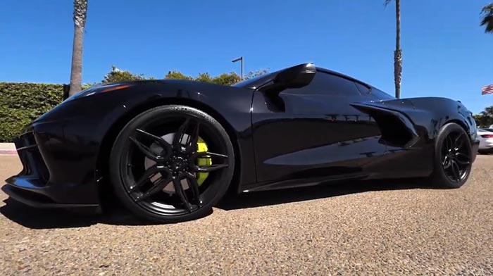 A lowered Black C8 Corvette