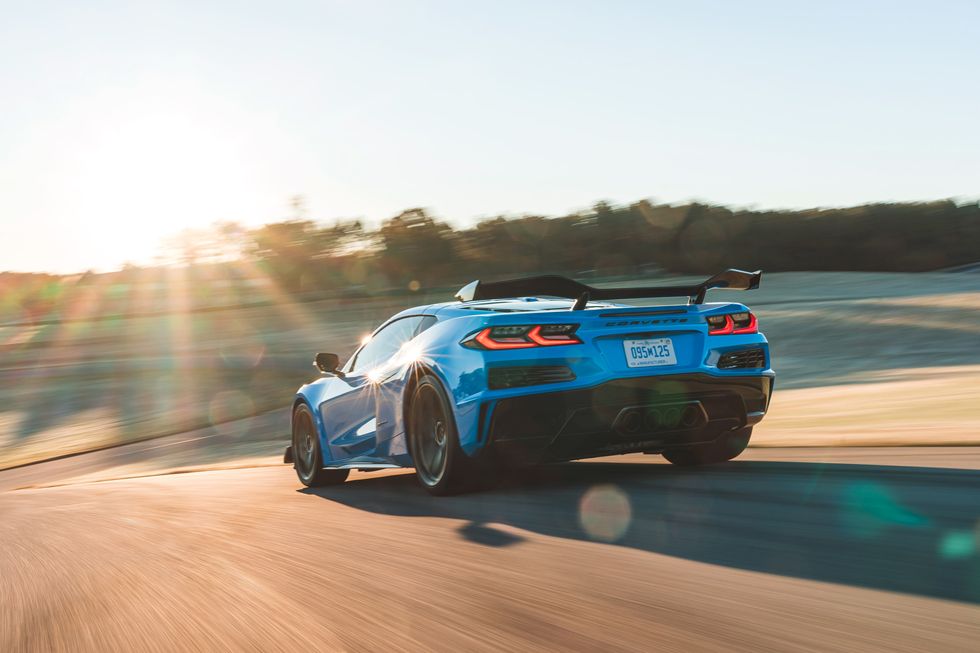 Rear view of a Rapid blue C8 z06 on the track