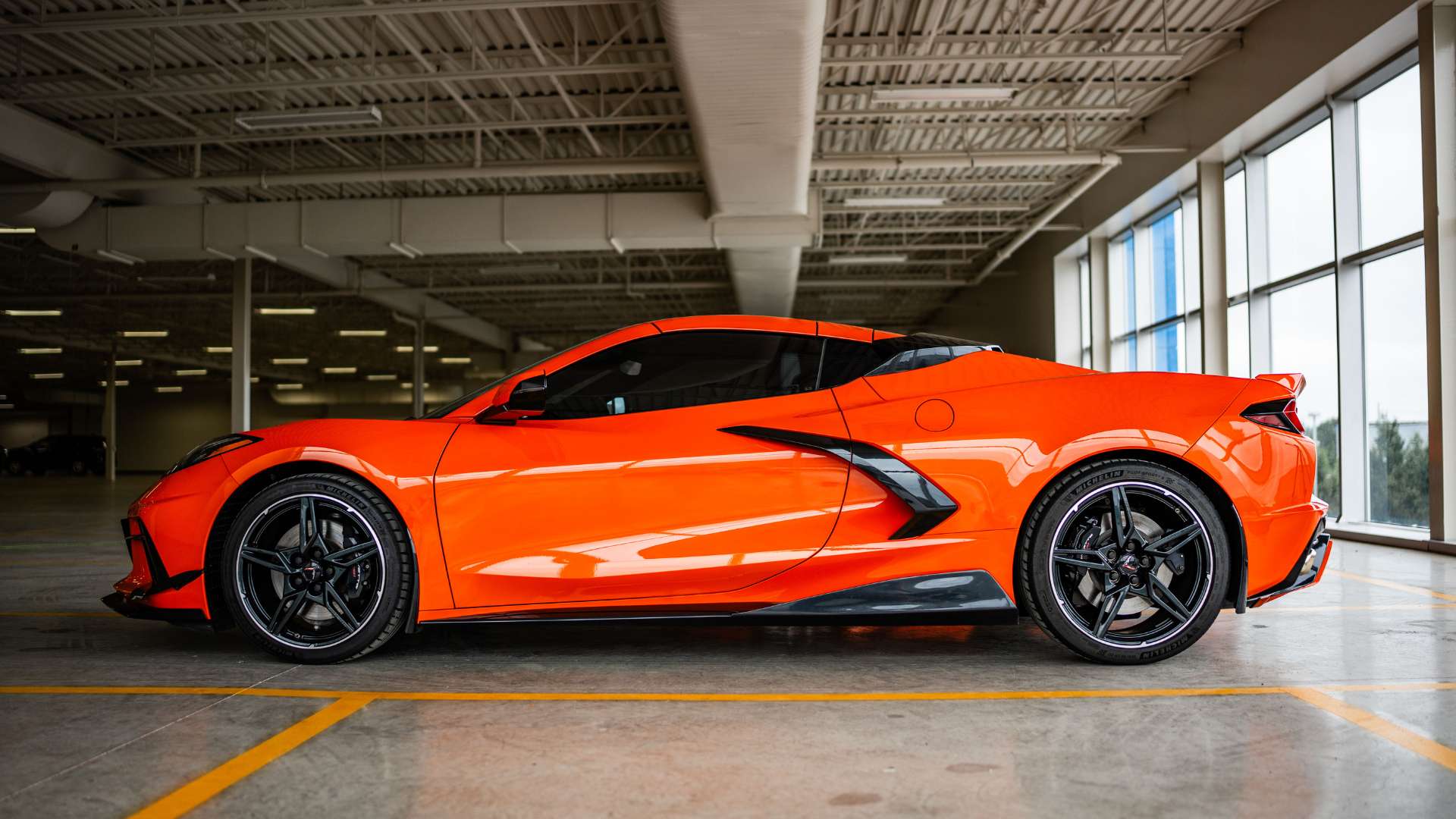 profile view of a Sebring Orange C8 Corvette with the ACS RQ Intake Ports installed