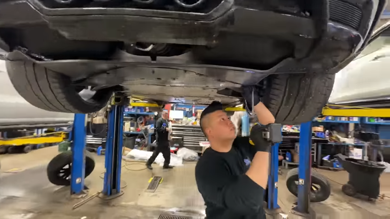 Technician performing PDI on a Corvette Z06