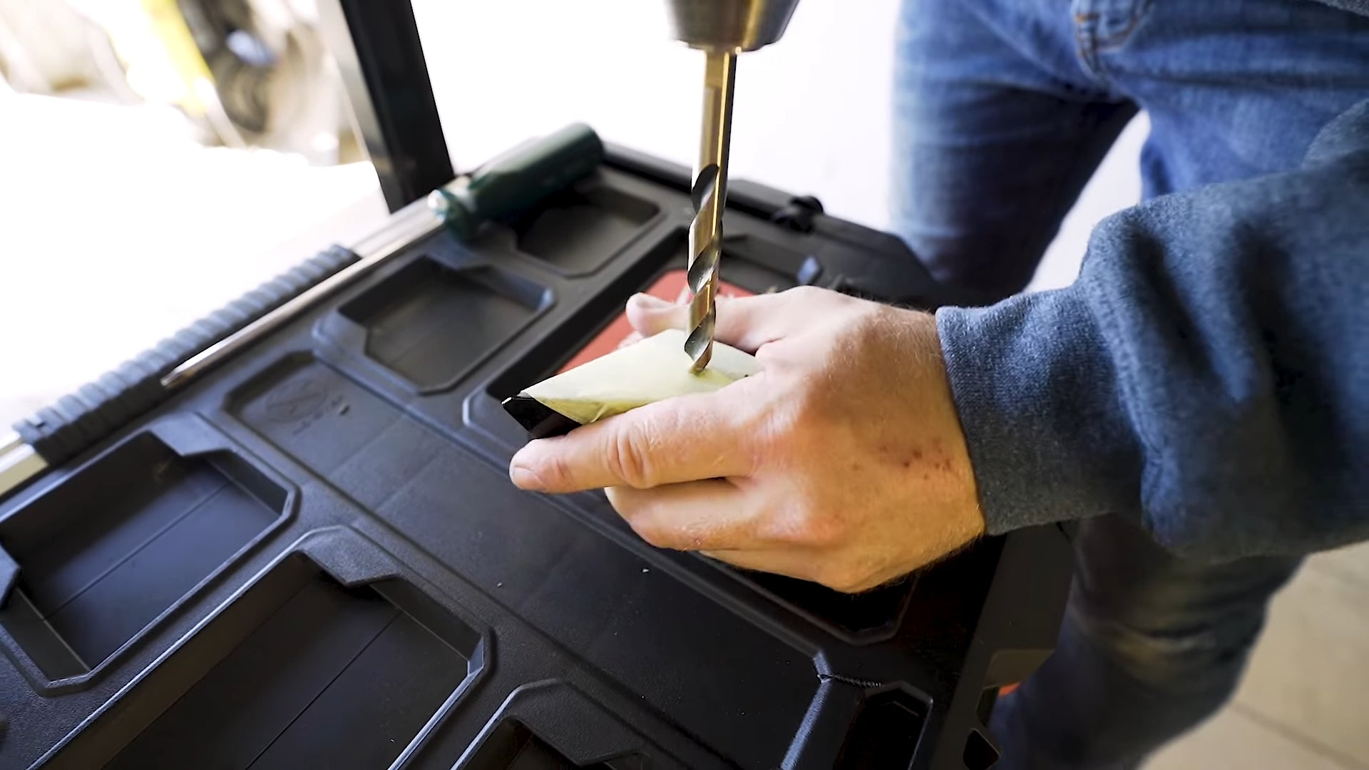 Use a 10mm drill bit to turn the pilot hole into a nominal hole that will fit the rivnut.