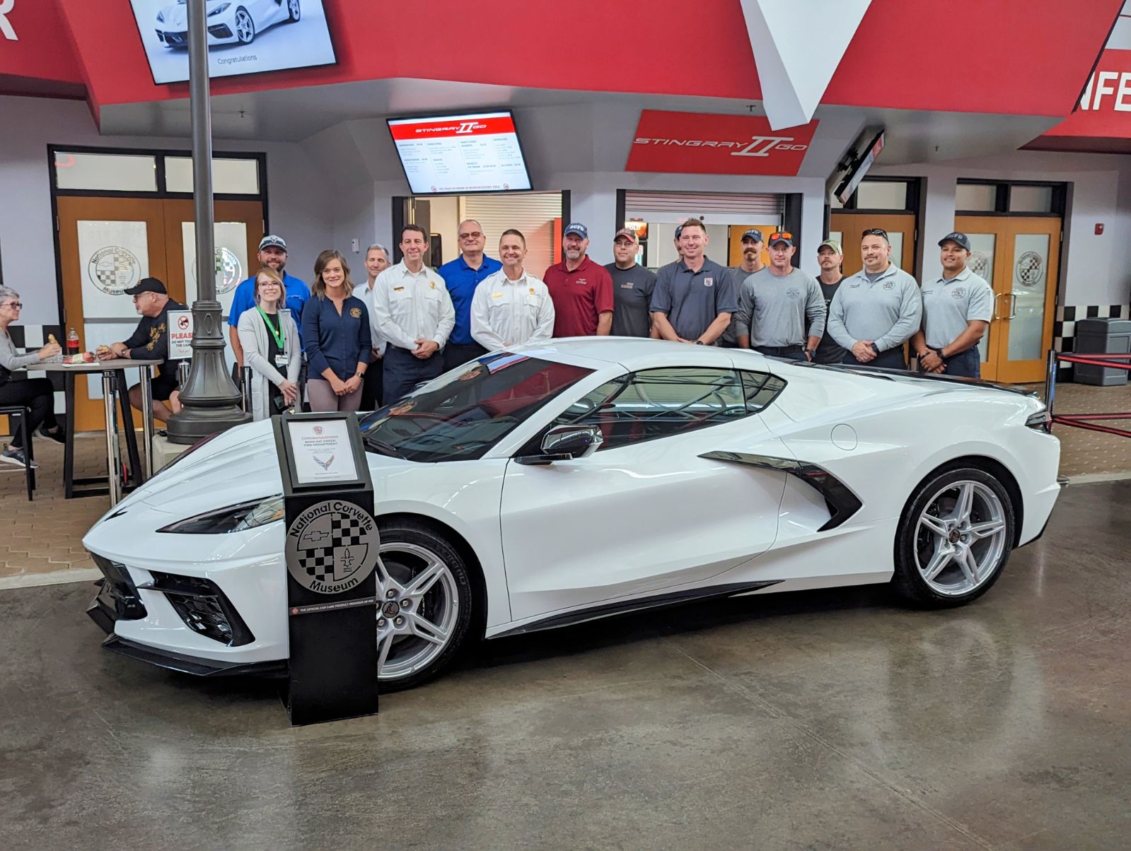 Bowling Green Fire Department behind their Arctic White C8 Corvette