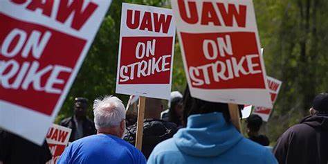 Picketers holding UAW signs