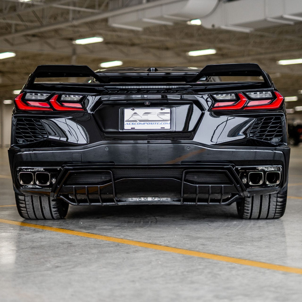 Rear view of a C8 Corvette in black with ACS diffuser