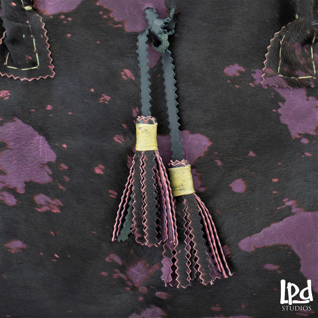 Overdyed Purple Plum Brindle Fur Leather Tote with Tassels - LPDstudios was created by designer artist Lisa Parmer Ditty. All of her designs are handcrafted in her Pennsylvania studio. She has merged her love of leather, metal and metal clay to create a unique collection of custom leather handbags, metal and leather jewelry and even pet collars. Follow her studio blog and see what she is designing next.