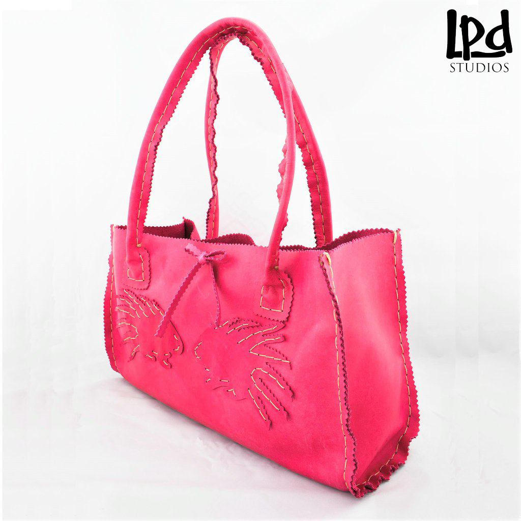 LPDstudios - Lipstick Pink Nubuck Leather Purse with Porcupines - LPDstudios was created by designer artist Lisa Parmer Ditty. All of her designs are handcrafted in her Pennsylvania studio. She has merged her love of leather, metal and metal clay to create a unique collection of custom leather handbags, metal and leather jewelry and even pet collars. Follow her studio blog and see what she is designing next.