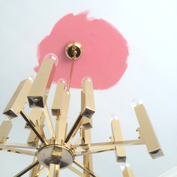 pink ceiling and vintage brass chandelier