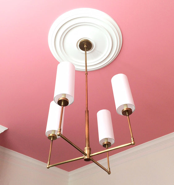 Ziyi 4 Light Chandelier against pink ceiling