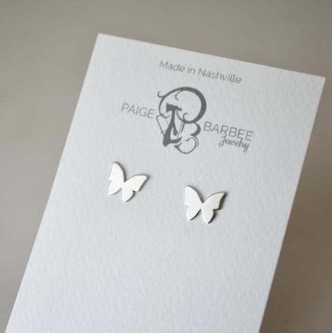 Image of silver butterfly studs on white backing card