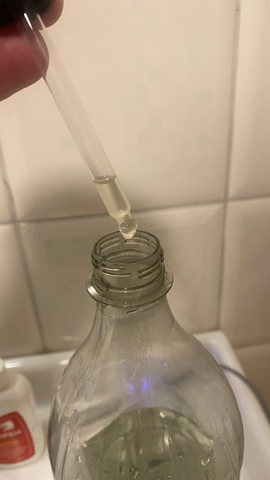 one drop of acetone into the half full plastic bottle
