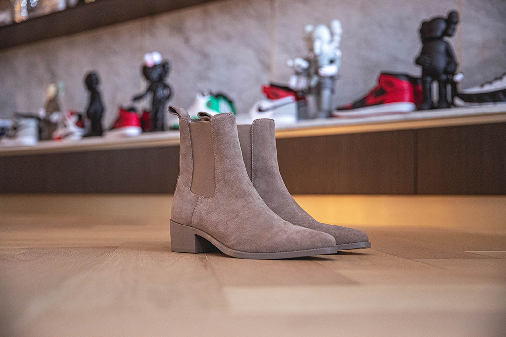 Shoe Wall showcasing the Nomad Pointy Toe Chelsea Boots up close