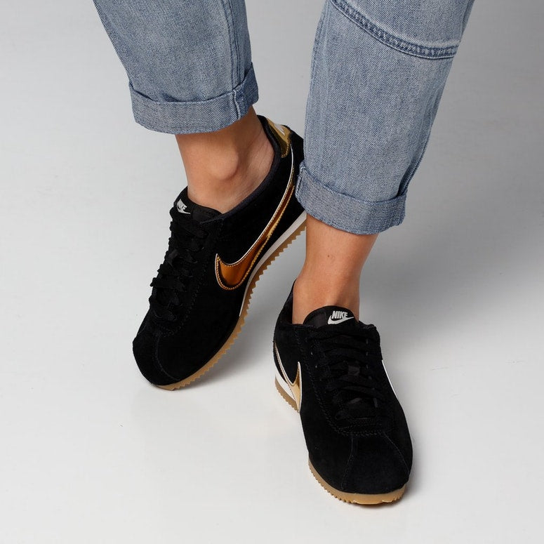 black and gold nike cortez womens