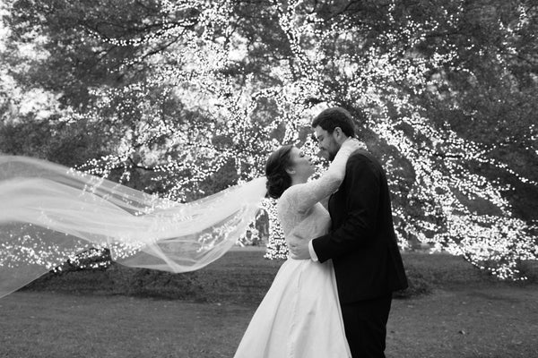 Kasey French Raley in a custom Sophie Hallette lace and double face satin wedding gown by designer David Peck for her wedding at the Houstonian Hotel Club and Spa, Houston, TX.