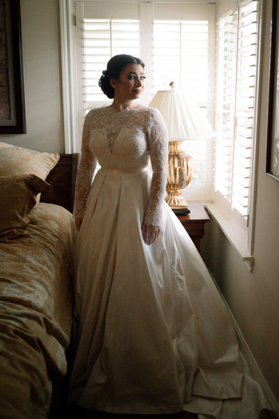 Kasey French Raley in a custom lace and double face satin wedding gown by designer David Peck