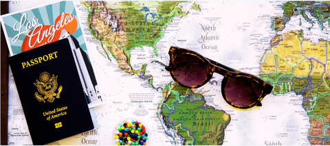 Passport, sunglasses, map