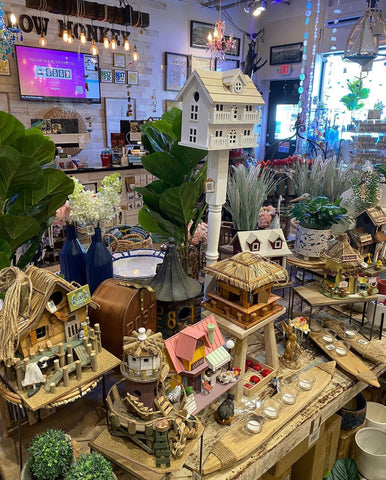 photo of inside the store showing a number of the whimsical birdhouses we have in the store.