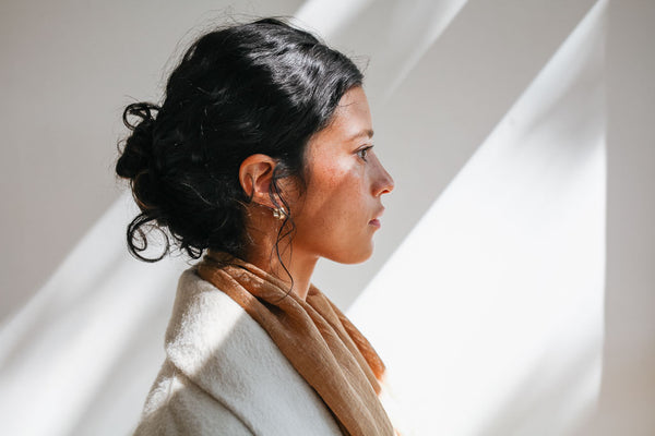 woman wearing fair trade small hoop earrings