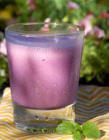Chilled glass of Huckleberry Mint Lassi made with Wine Forest Wild Foods Wild Huckleberry Shrub