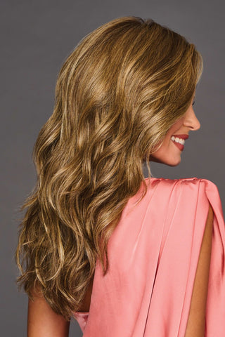 Stunning long wavy wig by Gabor. Shown in the color SS Honey Pecan a rooted creamy brown-blonde style.