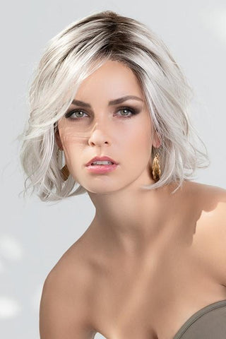 Sexy women looking forward wearing a slightly layered silver-white bob wig. Esprit by Ellen Wille in Silver Blonde Rooted