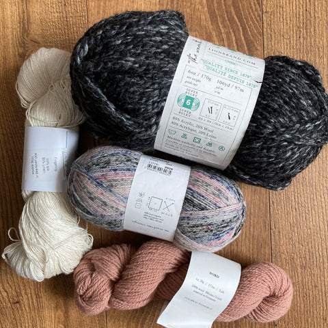 a picture of a selection of yarn with labels