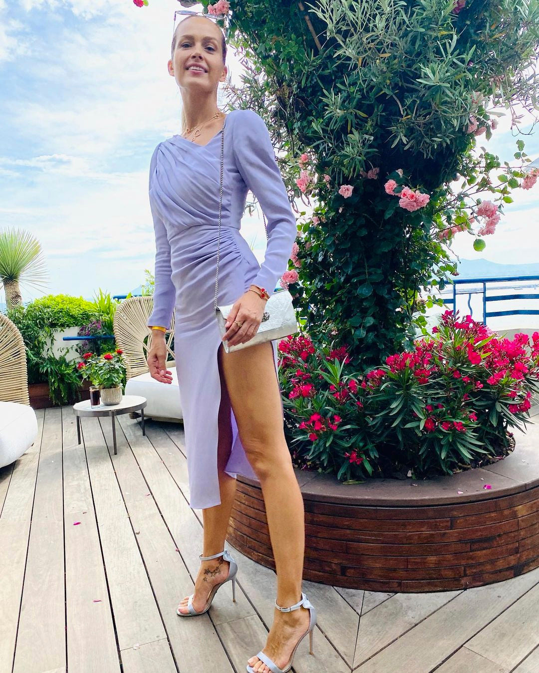 The supermodel momma—with her adorable son Bodhi—in a thigh-grazing lavender Bequartii number and our Venus designer vegan heels. | @pnemcova