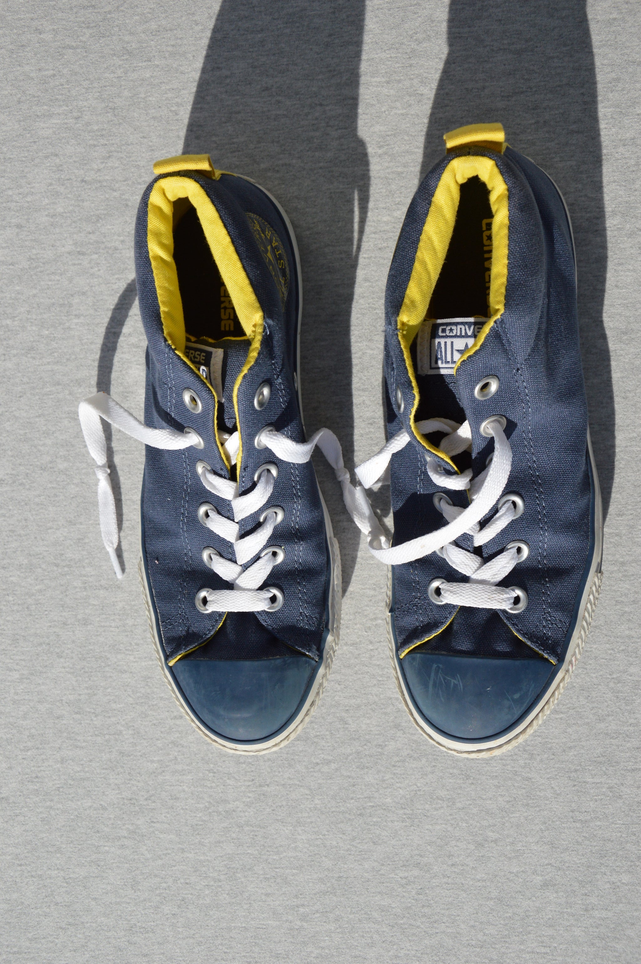 blue and yellow high tops