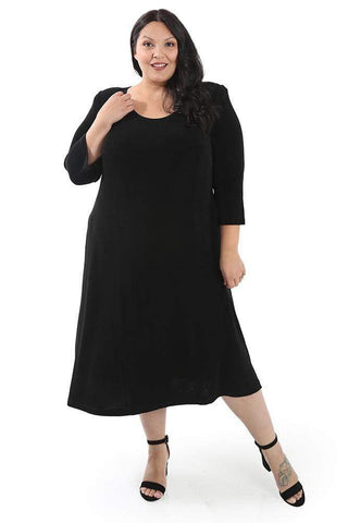 woman wearing a black plus size a line maxi dress