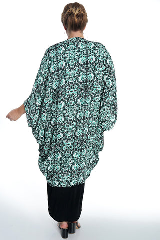 woman wearing a green dream cocoon duster