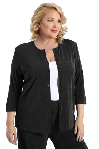 woman wearing black pants and a black cardigan