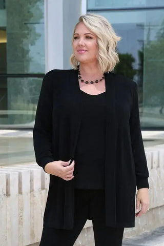 woman wearing black classic separates
