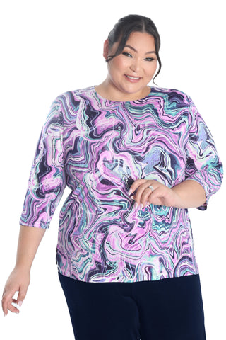 woman wearing a pink swirl top