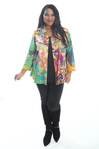 woman wearing a colorful print jacket over black separates