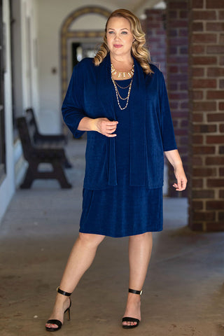 woman wearing a royal blue dress and kimono jacket