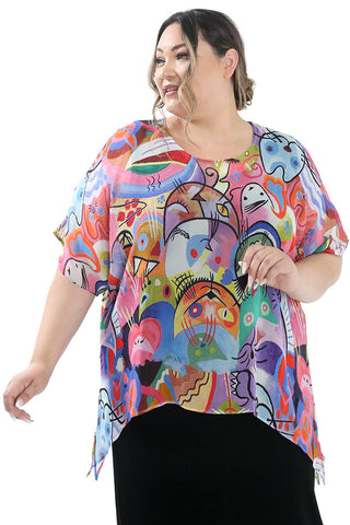 woman wearing a vivid cat print top