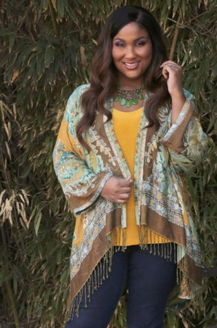 Allegra in a fringed shawl jacket