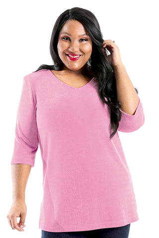 woman wearing a carnation pink tunic